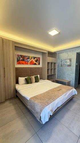 a bedroom with a large bed in a room at Sunshine Resort - Tabarja, Lebanon in An Nā‘ūrah