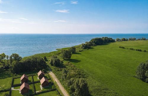 an aerial view of a farm with the ocean in the background at Mehrblick Kopice in Stepnica