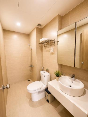 a bathroom with a toilet and a sink at Nera Stay Huế - Luxury Apartment in Hue