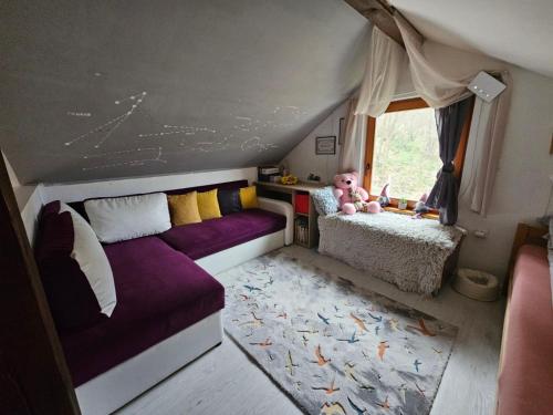 a small room with two beds and a teddy bear at Vikendica Šehić in Zavidovići