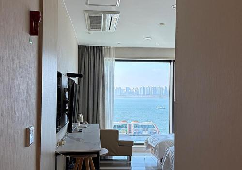 a hotel room with a view of the ocean at Wolmido Premiers Hotel in Incheon
