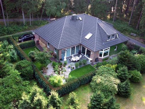 an aerial view of a house with a car in it at "Haus Waldblick" in Bad Bramstedt
