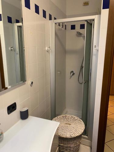 a bathroom with a shower with a sink and a toilet at casa raffa megaride's dépendance in Como