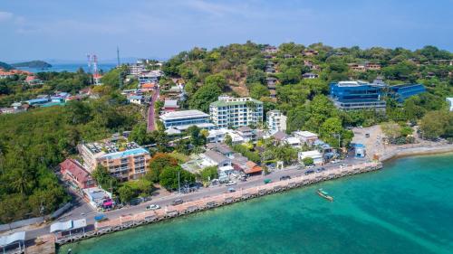 an aerial view of a city next to the water at Kantary Bay Hotel Phuket in Panwa Beach