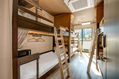 A bunk bed or bunk beds in a room at Kintetsu Friendly Hostel Osaka Tennoji Park