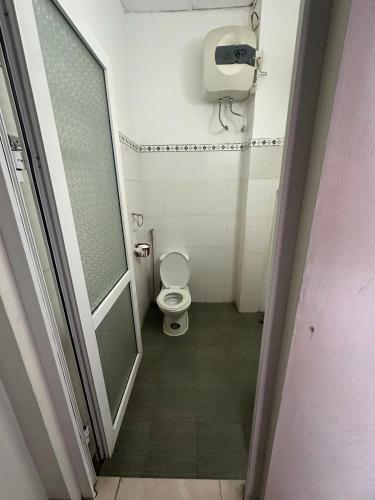 a bathroom with a toilet and a shower stall at Khách sạn Thuỷ Chi in Bắc Quang