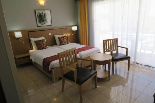 Postel nebo postele na pokoji v ubytování Central Hotel
