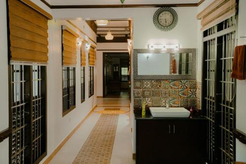 a bathroom with a sink and a mirror at Poomuttathillam in Kunnamangalam