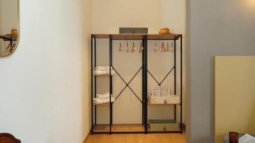 a shelf in the corner of a room at Casa Panerole in Novello