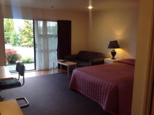 Postel nebo postele na pokoji v ubytování Central Park Motor Inn