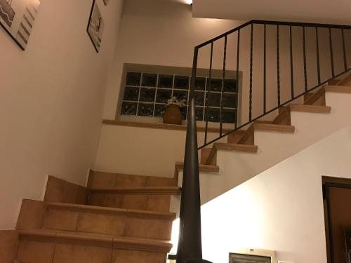 a staircase in a house with a stair case at I Cardinali in Santa Marinella