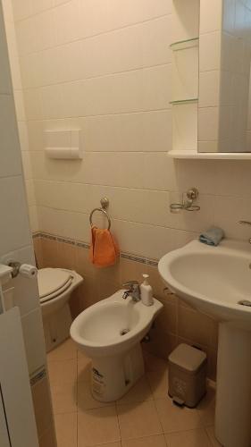 a bathroom with a sink and a toilet at Il respiro del mare in Montesilvano
