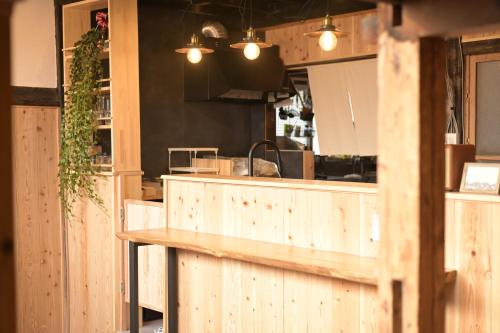 a kitchen with wooden counters and a counter top at guesthouse碧 in Okinoshima