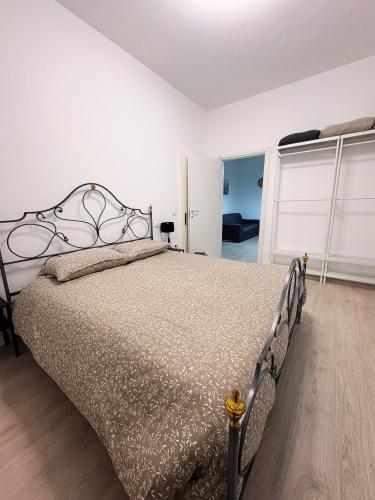 a bedroom with a large bed in a room at Alla Pergola in Ceniga