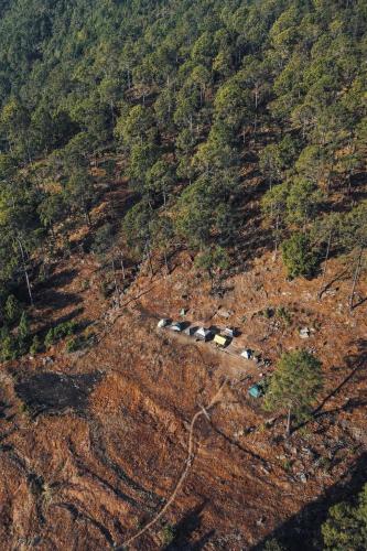 an aerial view of a mountain with a group of tents at Tent-It India Experiences in Mukteshwar