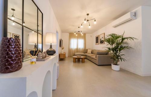 a living room with a couch and a table at Casa Dara's Sea in Playa Honda