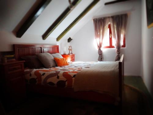 a bedroom with a bed and a window at Holiday Home Milica in Kolašin