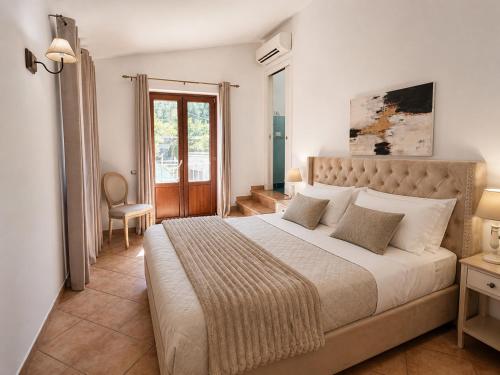 a bedroom with a large bed in a room at Villa Rosmary in Massa Lubrense