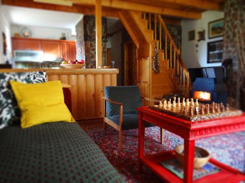 a living room with a chess board on a table at Holiday Home Milica in Kolašin