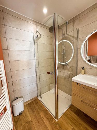 a bathroom with a shower and a sink at La Tour Alba in Valras-Plage
