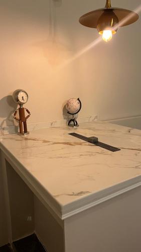 a white counter with two objects on top of it at اليمامه in Al Yamāmah