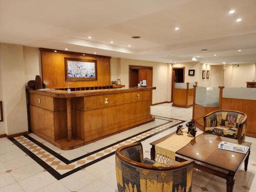 a large room with a table and a counter at Hotel Piero in Villa Mercedes