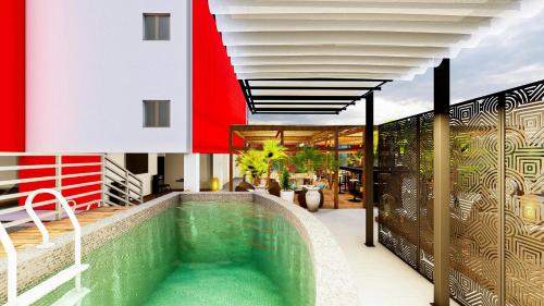 a swimming pool on the roof of a house at IBIS LAGOS LEKKI in Lagos
