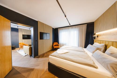 a bedroom with a large bed in a room at Hostel SLEPS in Augsburg