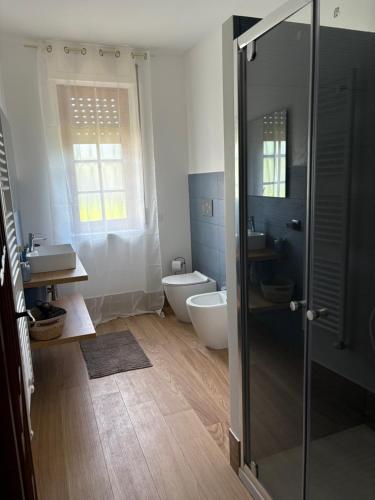 a bathroom with a shower and a toilet and a sink at Villa Filomena in Montoro Inferiore