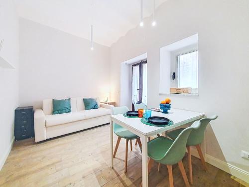 a living room with a table and chairs and a couch at Apartment Studio Kalè Akté by Interhome in Caronia