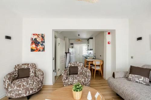 a living room with two couches and a table at Güneş Villa Bahçe Katı in Antalya
