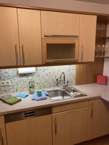 a kitchen with a sink and a microwave at Ferienwohnung Marienhof in Bad Aussee