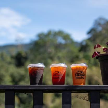 three cups sitting on top of a rail at วิวดี ป่าเหมี้ยง โฮมสเตย์ in Ban Pa Miang
