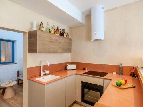 a kitchen with a sink and a counter top at Apartment Edificio Candela-1 by Interhome in L'Ametlla de Mar