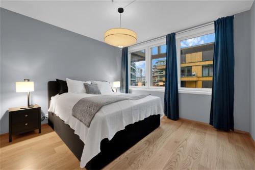 a bedroom with a large bed and a window at Modern Apartment in Ski in Siggerud