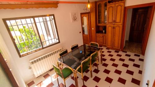 a room with a table and chairs and a window at Ruralux Sierra Castril in Huéscar