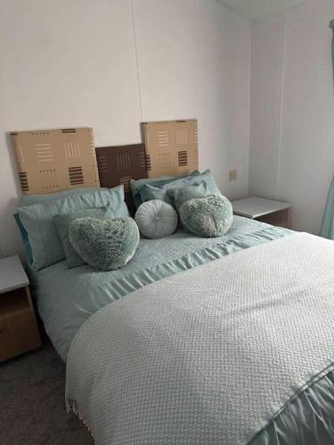 a bed in a room with boxes on top of it at Jude 615 in Barmouth