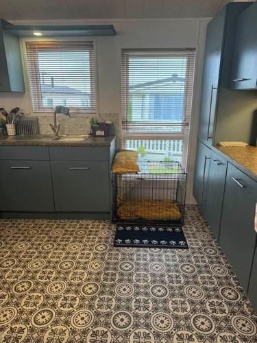 a kitchen with a sink and a counter top at Jude 615 in Barmouth