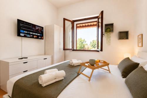 a bedroom with a large bed and a window at AMBRA - Casa Vista Mare in San Teodoro