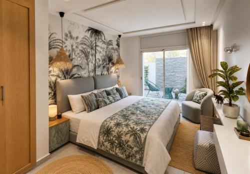 a bedroom with a large bed and a window at Maison Bella View in Moulay Bousselham