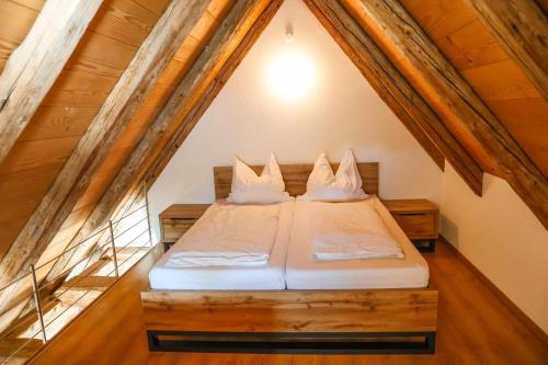 a bedroom with a bed in the attic at Altes Schulhaus in Heiligenberg