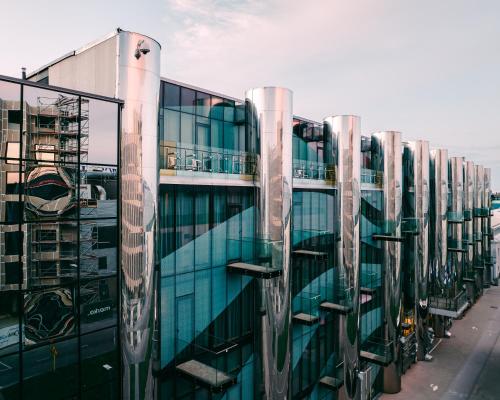 a tall glass building with a lot of windows at Tallink Spa & Conference Hotel in Tallinn