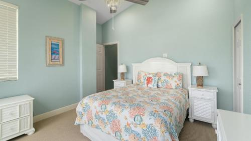 a bedroom with a bed and two night stands at 203 Mariners Club in Key Largo