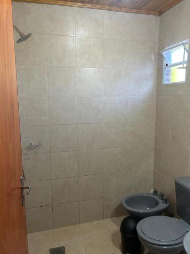 a bathroom with a toilet and a sink at Plaza Hohenau in Hohenau