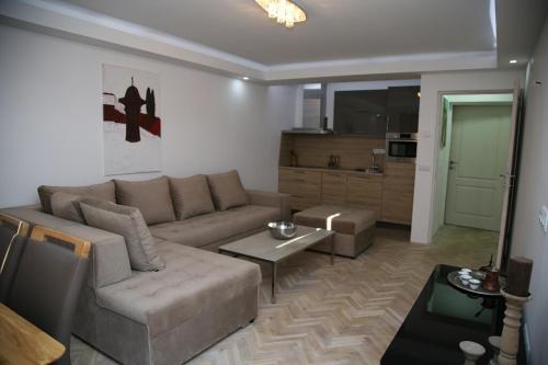 a living room with a couch and a table at Sarajevo Luxury Apartments in Sarajevo