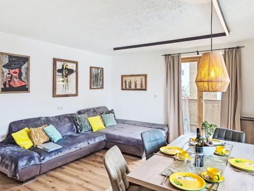 a living room with a couch and a table at Apartment Schöser by Interhome in Weerberg