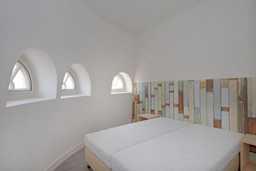 Een bed of bedden in een kamer bij Watertoren Vlissingen