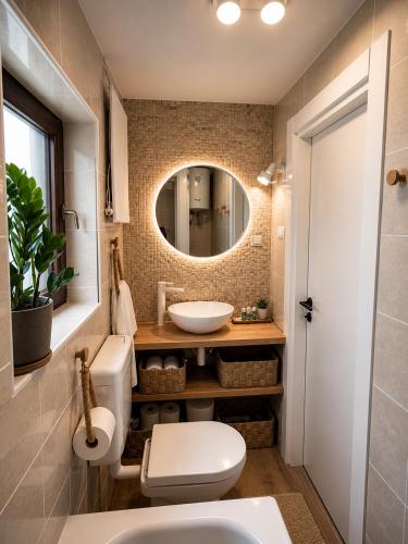 a bathroom with a sink and a mirror at La Casa Kiara - Heated Pool, Jacuzzi & Forest View in Stubicke Toplice