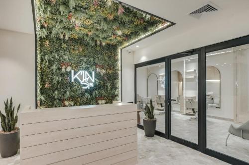 an office with a green wall with flowers at Fort George Hotel and Spa in Belize City