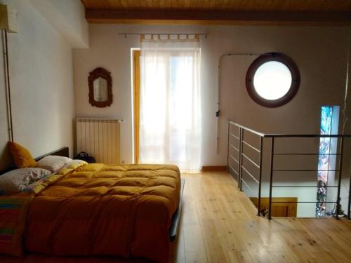 a bedroom with a bed and a window and a dresser at A Ciciredda in Barrafranca